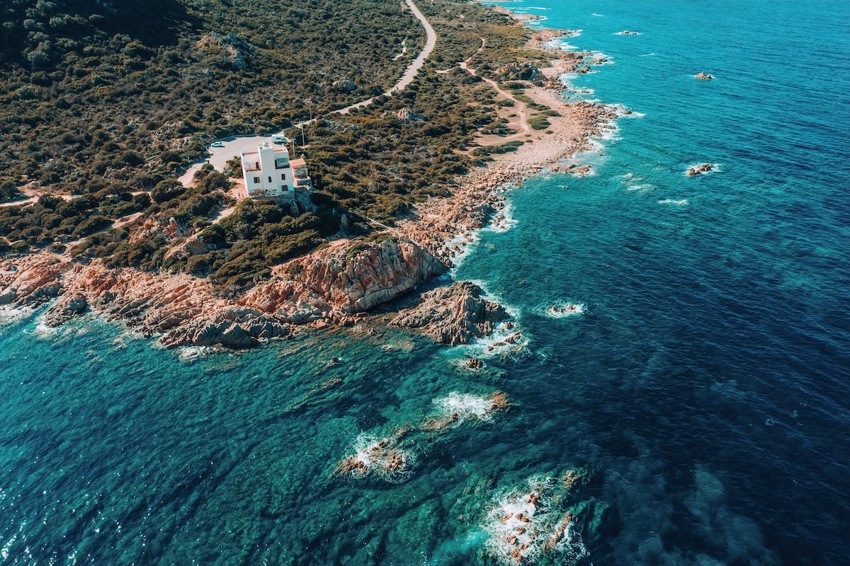 a picture of Faro di Capo Comino in Sardinia, Italy.