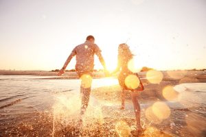 a romantic couple at the beach in sardinia