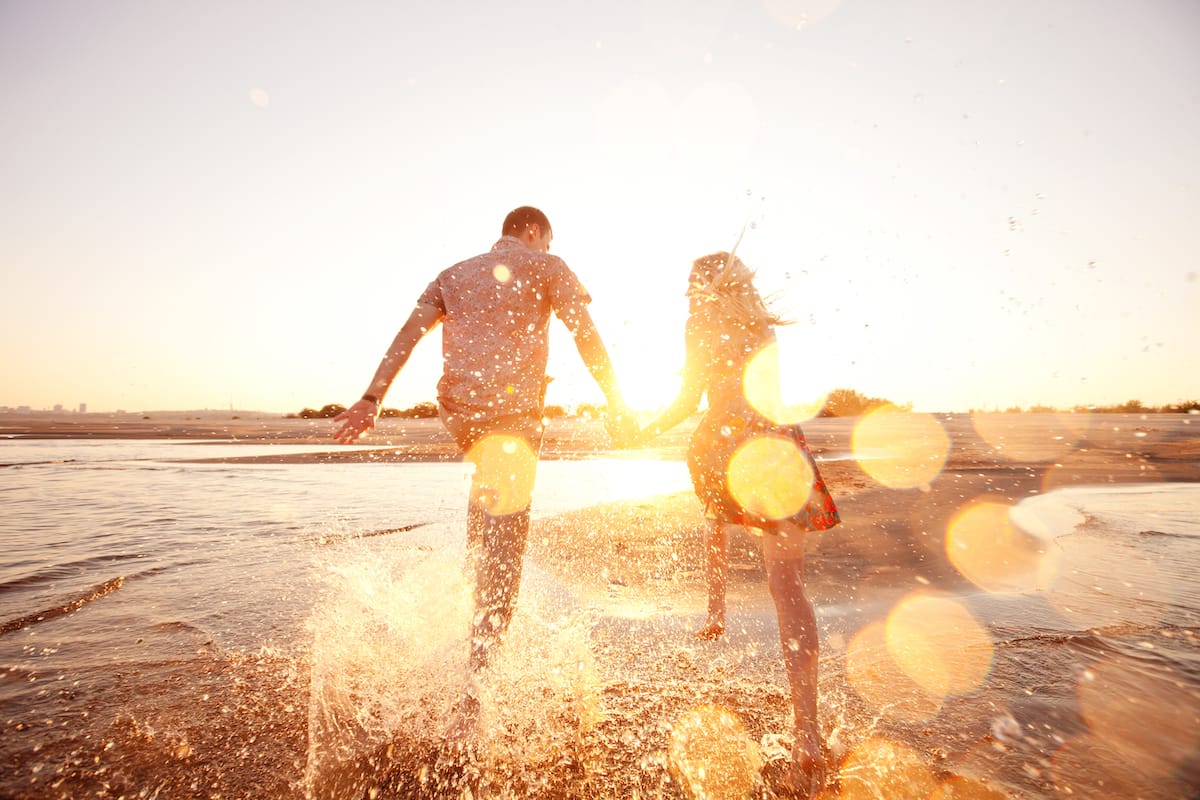 a romantic couple at the beach in sardinia