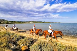 horseback riding along the coast of Isola Maddalena, Sardinia.