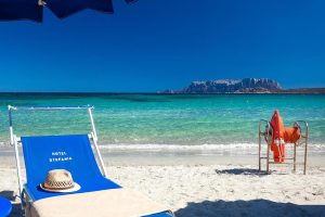 Gorgeous views of Isola Tavolara in the distance from the private beach section at Hotel Stefania, a four-star boutique hotel in Pittulongu, north-east Sardinia.