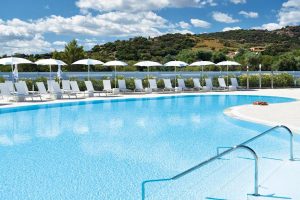 an inviting outdoor pool ready to pamper guests at the Piccolo Hotel in Porto Ottiolu, Sardinia.