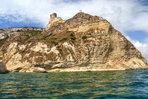 A view from the waters near Devil's Saddle, a famous rocky outcrop on the headlands of Capo Sant'Elia, in Cagliari, south Sardinia.