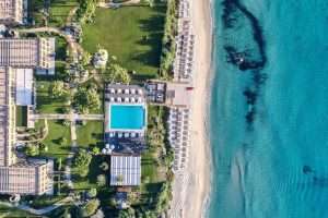 An aerial view of the lush gardens and infinity pool at La Villa del Re in Sant'Elmo, southeast Sardinia, Italy.