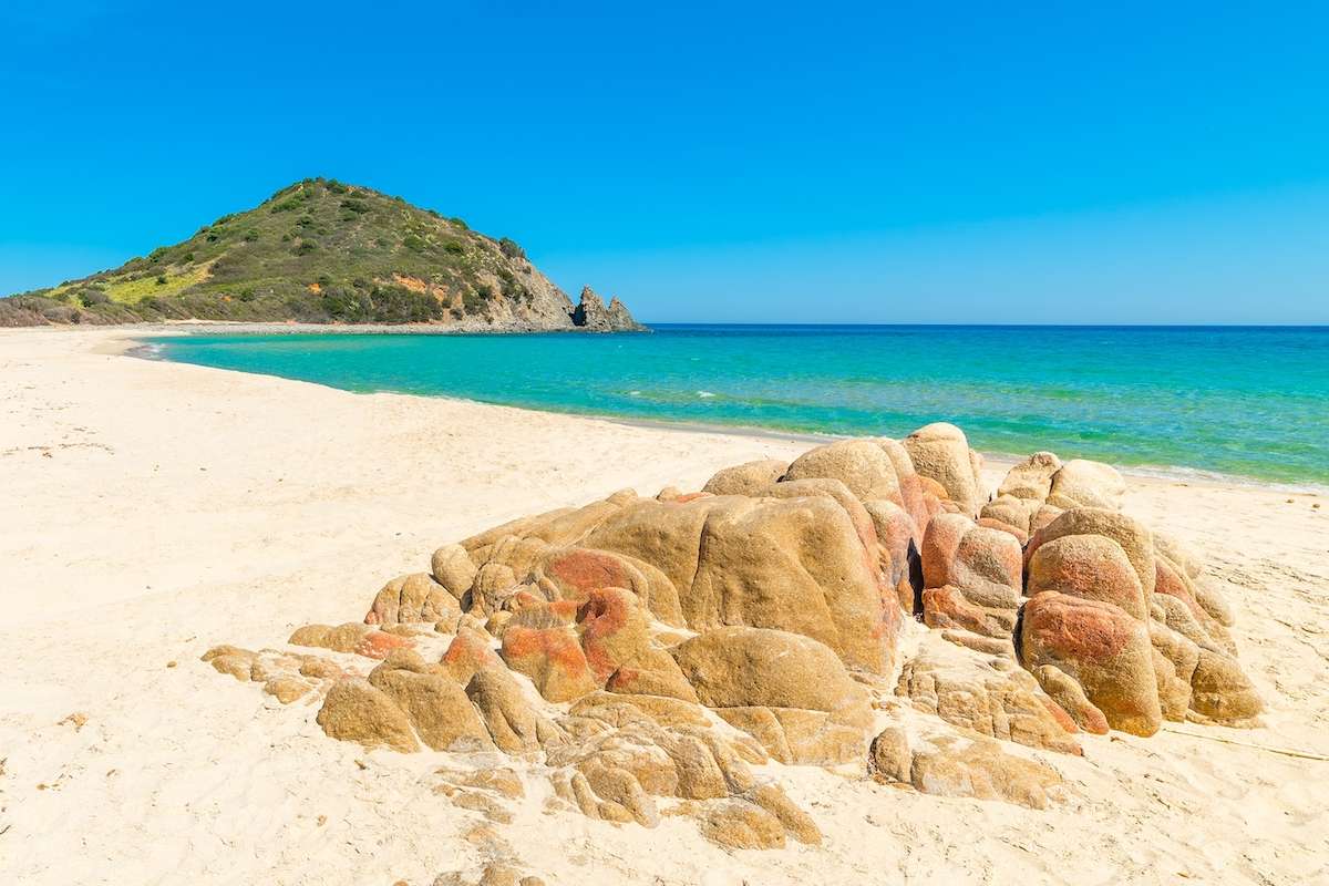 A group of rocks scattered on the beach of Cala Monte Turno, near Sant'Elmo, southeast Sardinia, Italy.