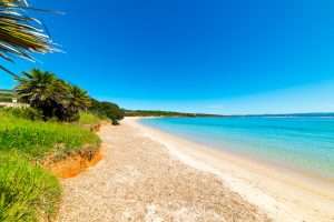 A view to the north along Spiaggia del Lazzaretto, one of the best beaches near Alghero, northwest Sardinia, Italy.