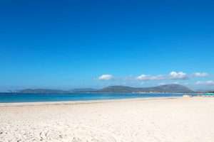 Views of a quiet day at the beach of Spiaggia di San Giovanni near Alghero, northwest Sadrinia, Italy.